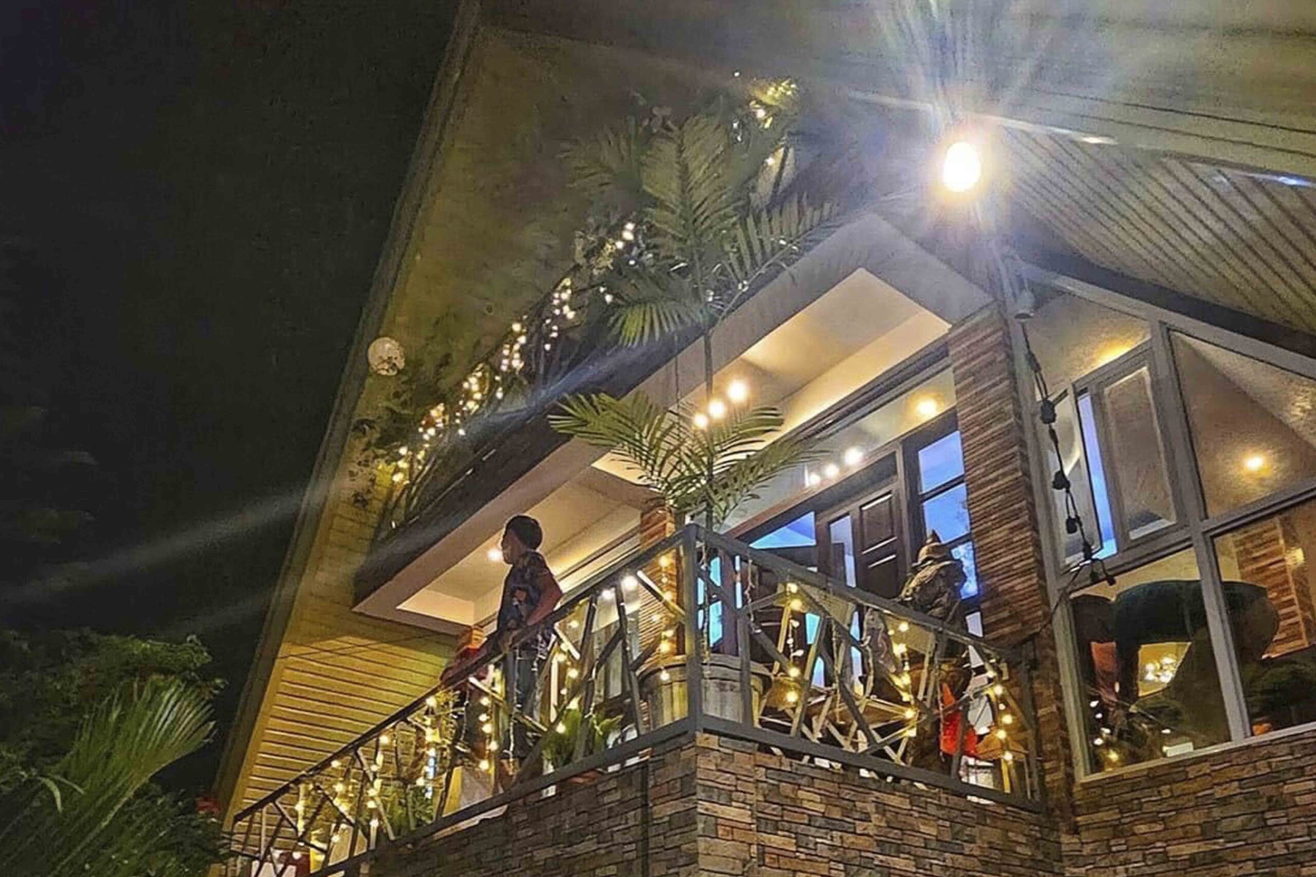 Commercial building adorned with festive holiday lighting, showcasing illuminated architectural features and a welcoming atmosphere, enhancing brand visibility and customer attraction.